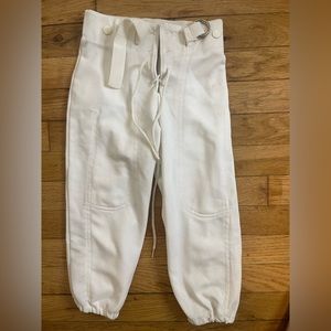Black and white pair of youth small football pants